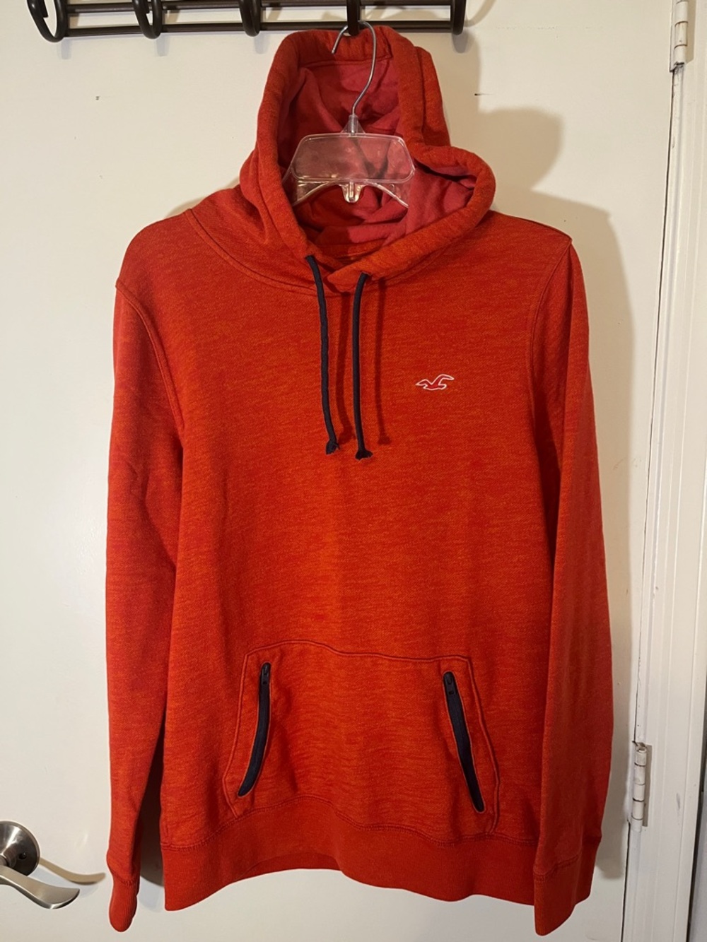 Hollister women orange hoodie size small with feature of zipper kangaroo pocket